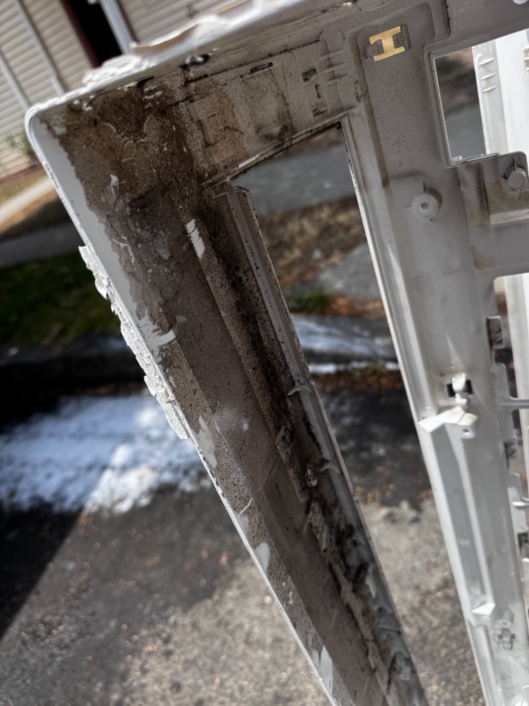 Dirty mini split panel before cleaning