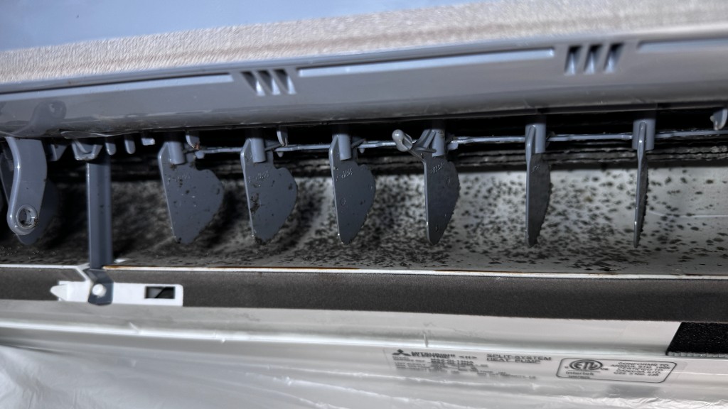 Dirty louvers and mold spots before cleaning