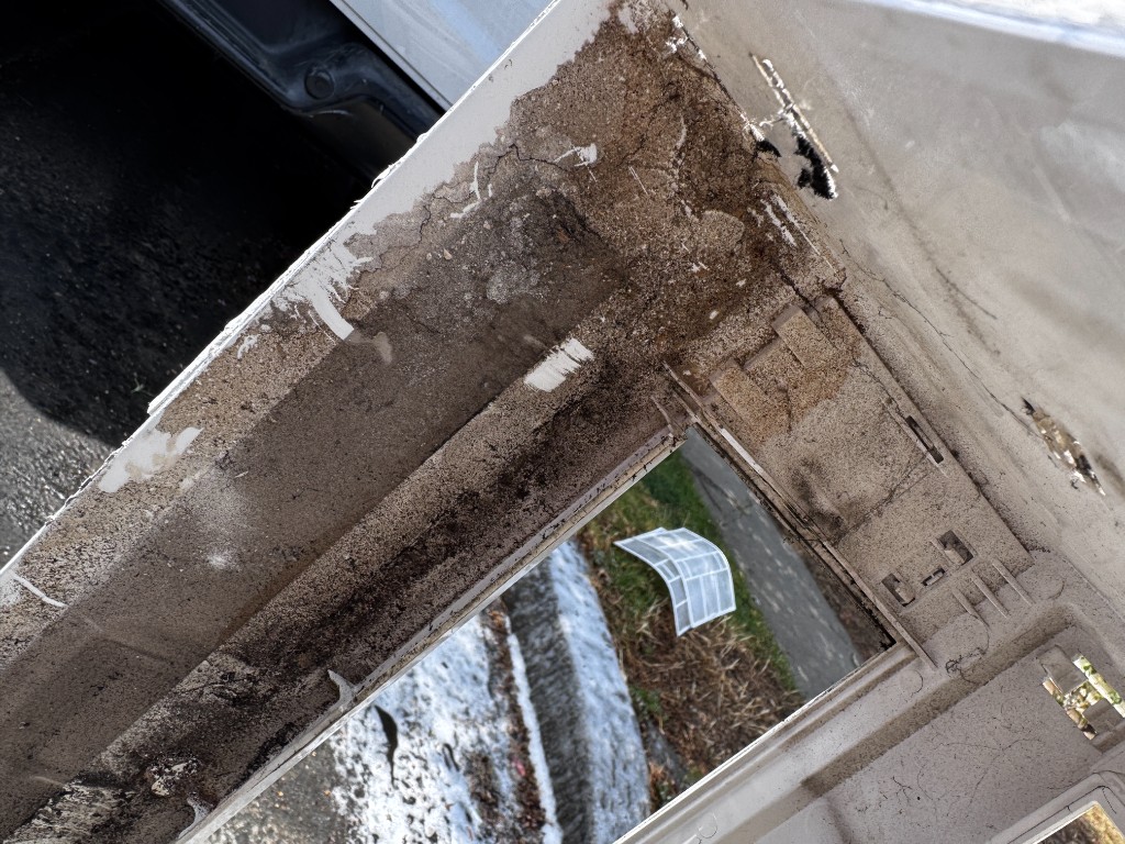 Heavy grime on AC cover before cleaning