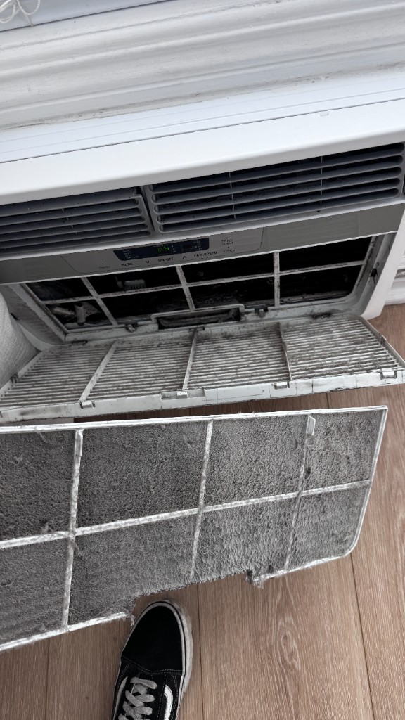 Clogged window AC filter before cleaning